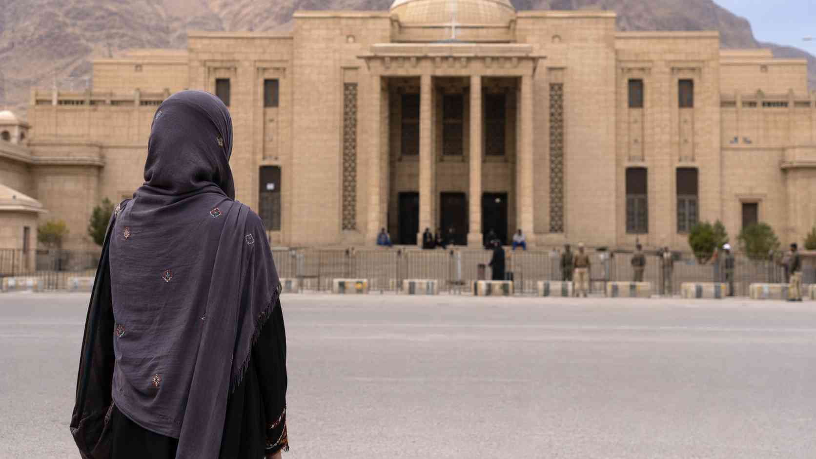 Mahrang Baloch life sentence symbolized by a Baloch woman facing a courthouse