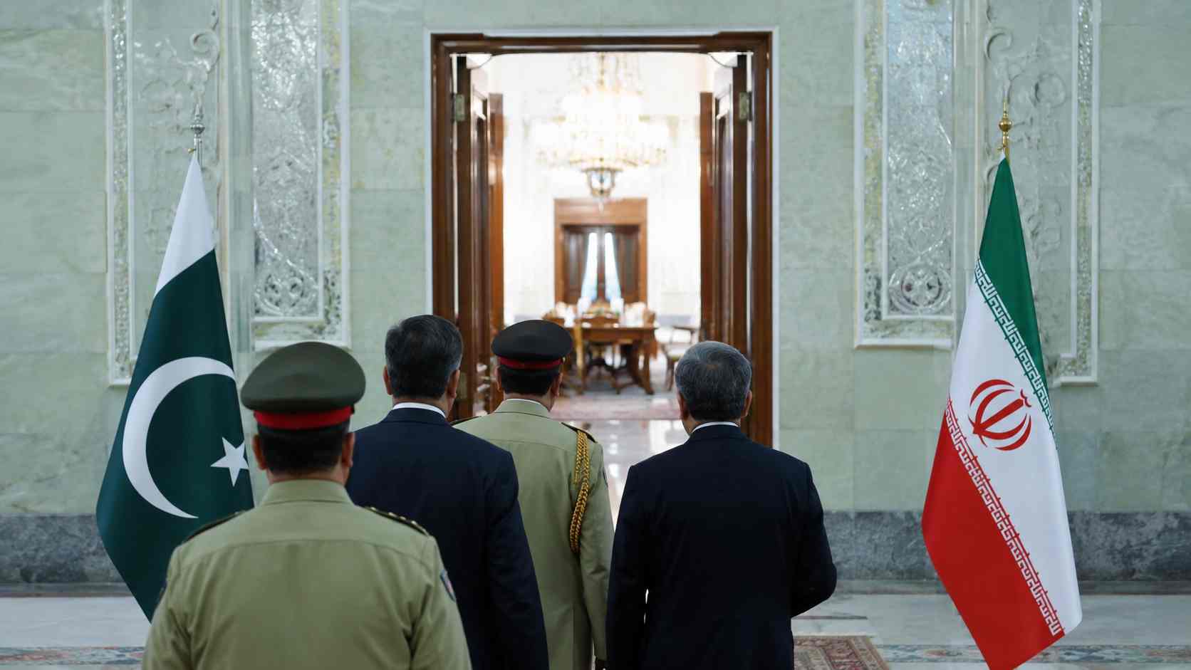 Asim Munir Tehran Visit represented by a Pakistani delegation approaching talks beside Pakistan and Iran flags